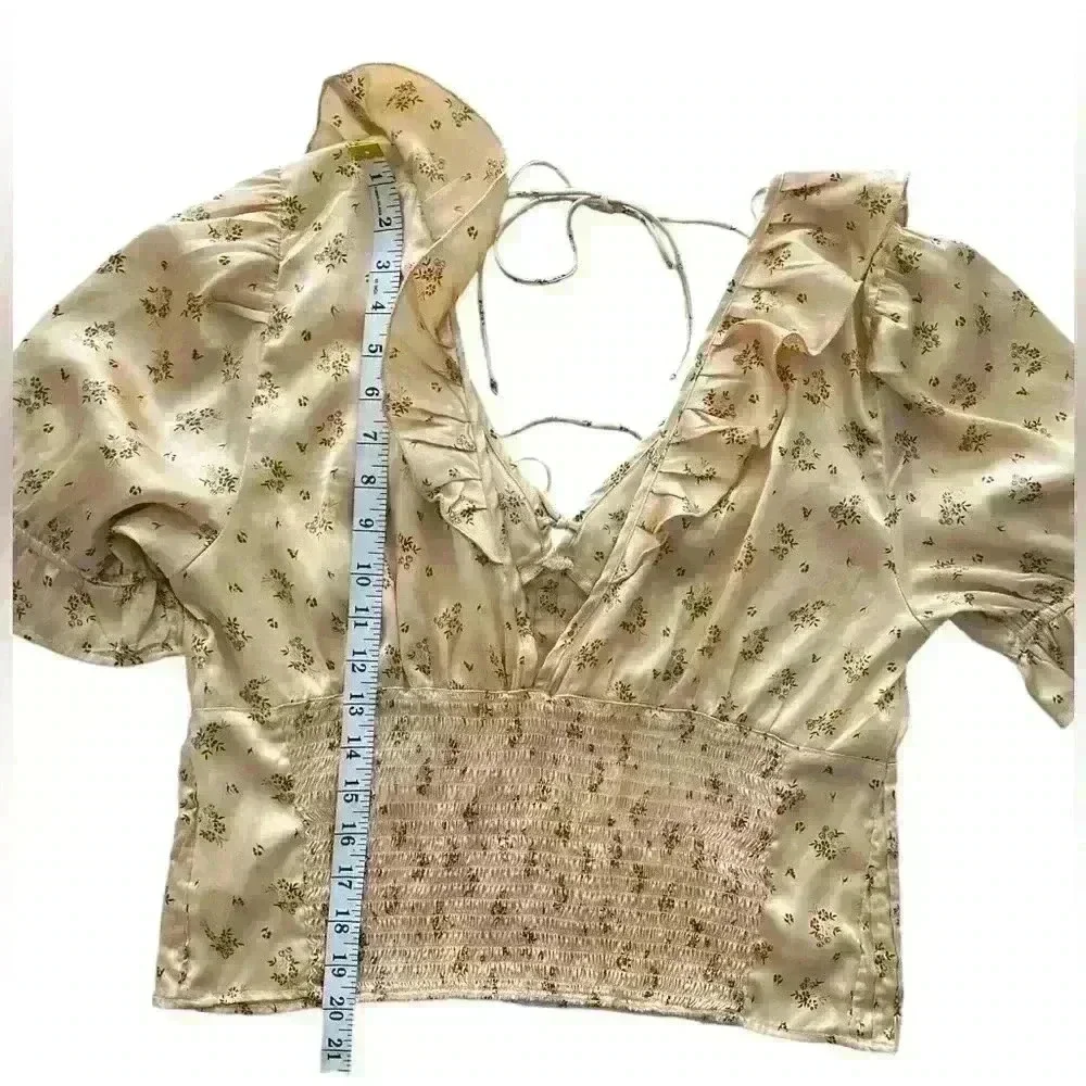 FREE PEOPLE Isabella Silky Floral Ruffle Babydoll Blouse in Copper‎ color
